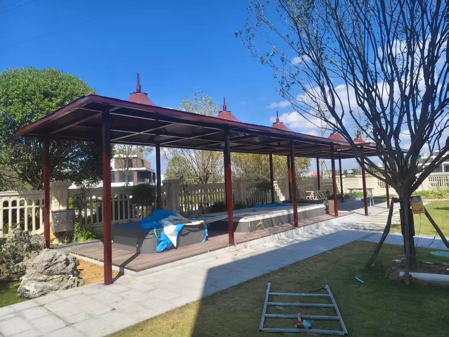贵州望谟园区小区膜结构停车棚怎么选?本地源头工厂拆解三大坑,避开返修翻倍成本